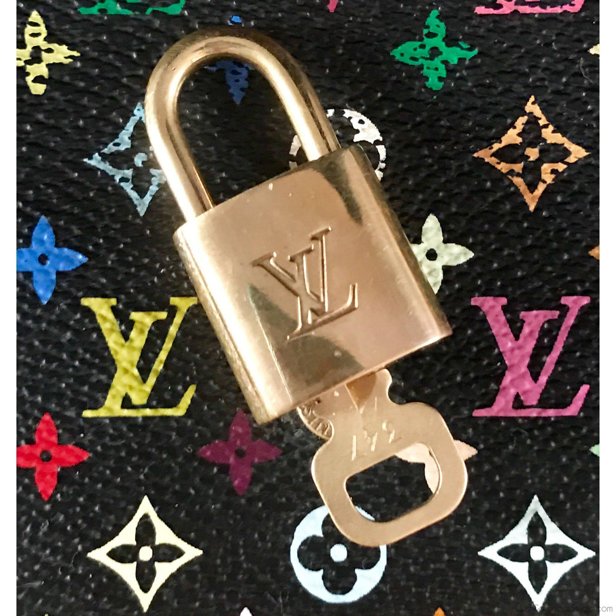 Louis Vuitton LOUIS VUITTON Porto Cle LV Stories Padlock Keychain