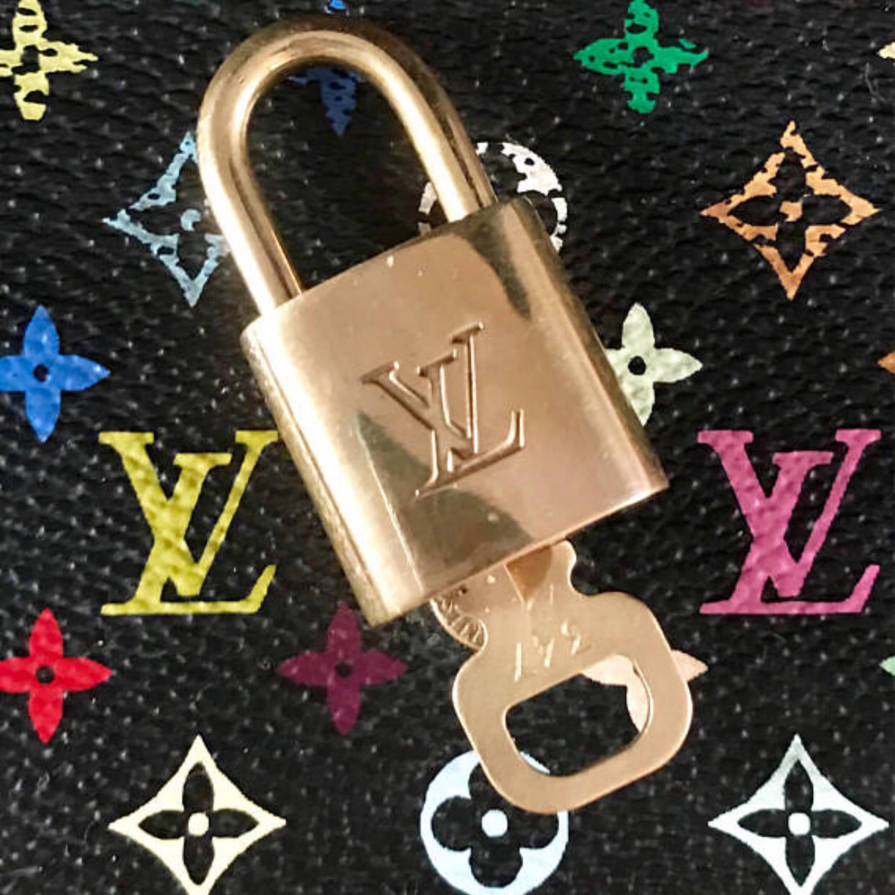 LOUIS VUITTON vintage leather/brass lock + key necklace