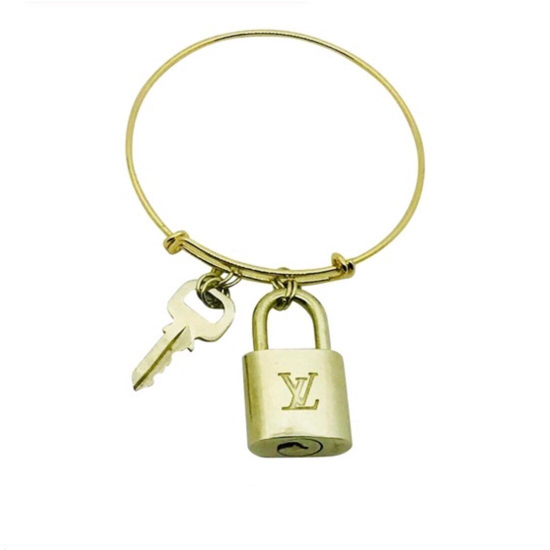 Louis Vuitton Gold Tortoise Print Resin Lock and Key Monogram Key Charm  Golden Metal ref.390119 - Joli Closet